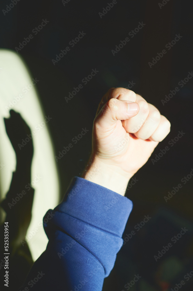 Man's hand makes gestures. Nonverbal communication. Clenched fist as a
