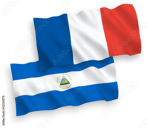 National vector fabric wave flags of France and Nicaragua isolated on white background. 1 to 2 proportion.