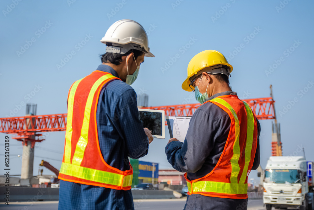 Team engineer Two man architect on a building construction site Team engineer Two man architect on a building construction site