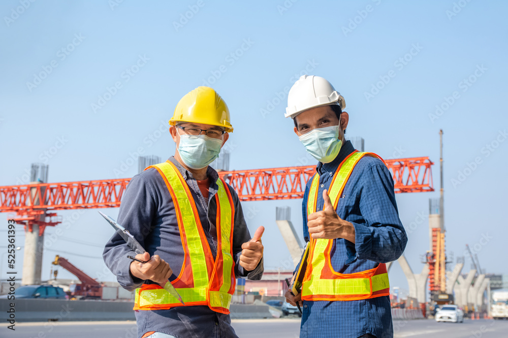 Team engineer Two man architect on a building construction site Team engineer Two man architect on a building construction site