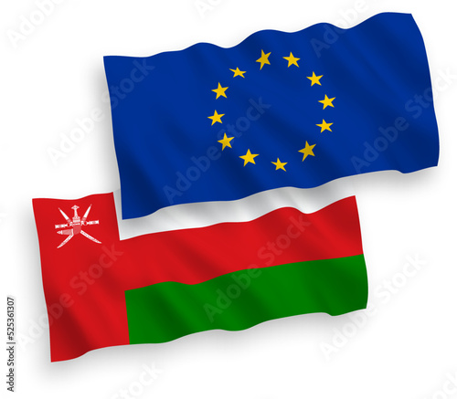 National vector fabric wave flags of European Union and Sultanate of Oman isolated on white background. 1 to 2 proportion.