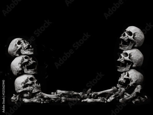 Awesome pile of skull human and bone on black cloth background, concept of scary crime scene of horror or thriller movies,Halloween theme, Still Life style, selective focus,