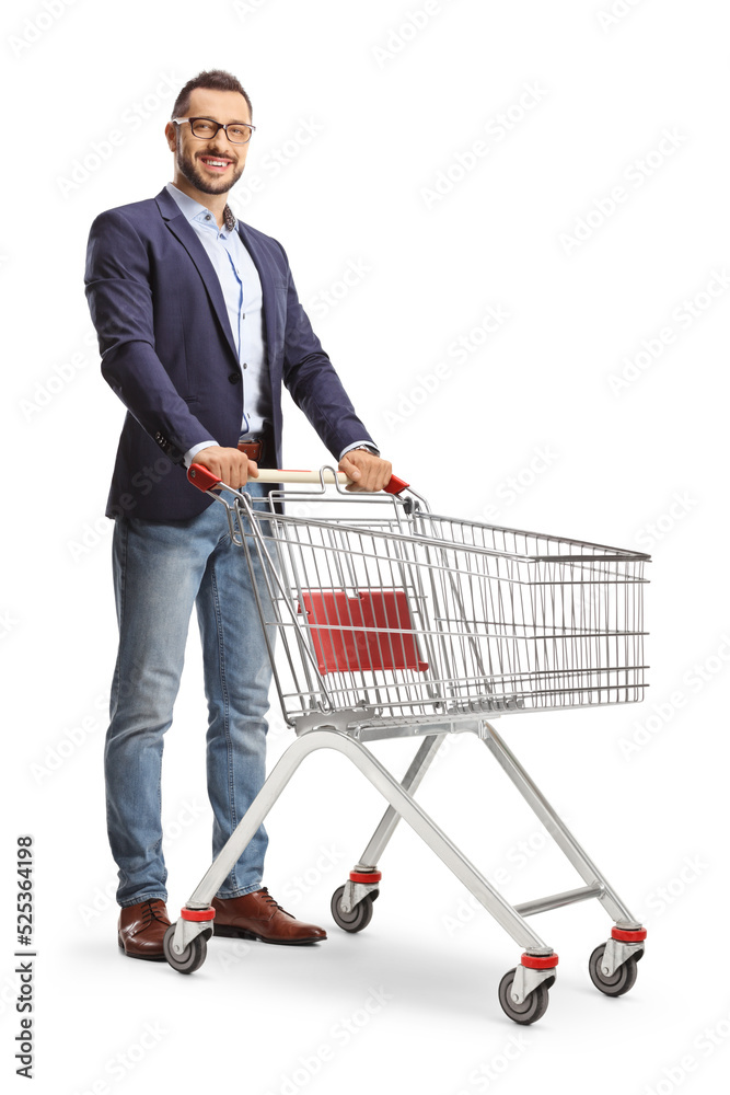 Young man standing with an empty shopping cart Young man standing with an empty shopping cart