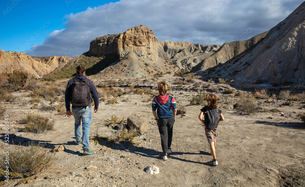 family walking in tabernas desert in Spain