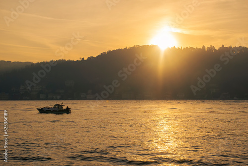 Men on a boat in Bosphorus waters in Istanbul. Fisherman in boat in Istanbul. Turkish fisherman sailing in boat in sea.