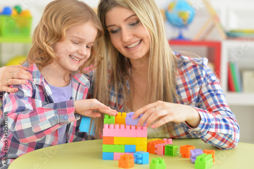 parents playing with daughters