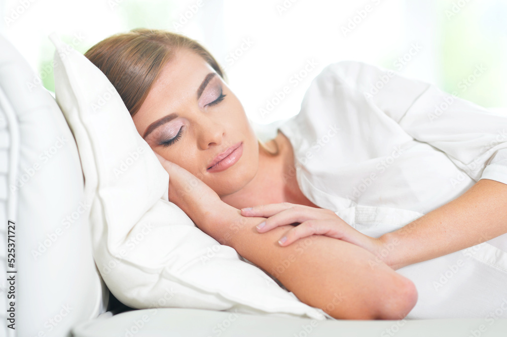 Beautiful young woman sleeping on soft bed in morning Beautiful young woman sleeping on soft bed in morning