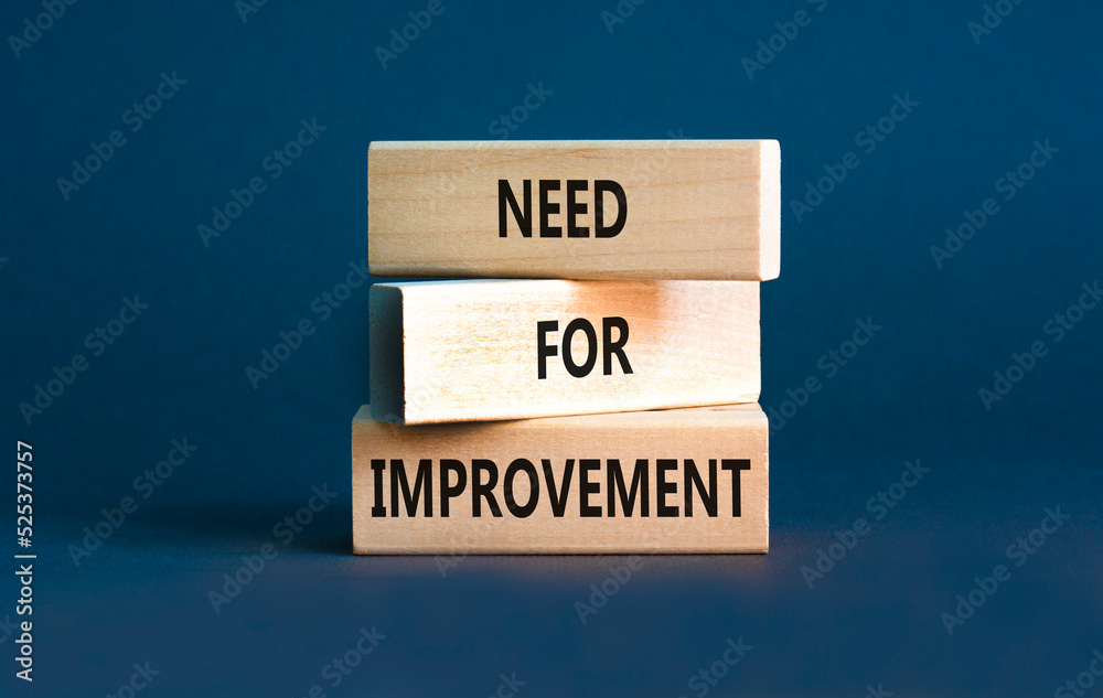 Naklejka premium Need for improvement and support symbol. Concept words Need for improvement on wooden blocks. Beautiful grey table grey background. Business, need for improvement quote concept. Copy space.