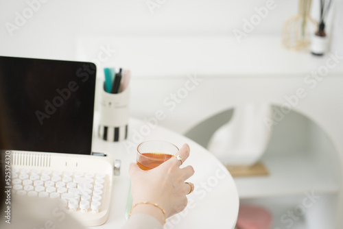 Fototapeta Naklejka Na Ścianę i Meble -  asian business and writer woman meeting online and typing by use retro keyboard and tablet