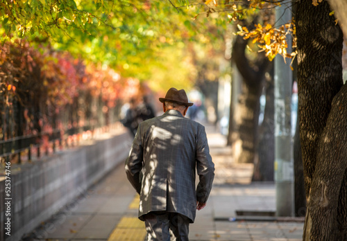 lonely man walking in autumn
