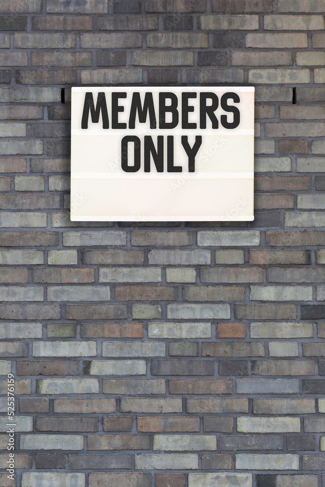 members only message in light box on brick wall members only message in light box on brick wall
