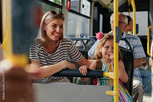 Woman and child riding city bus
