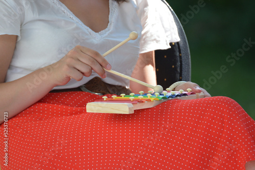 Girl playing xylophone