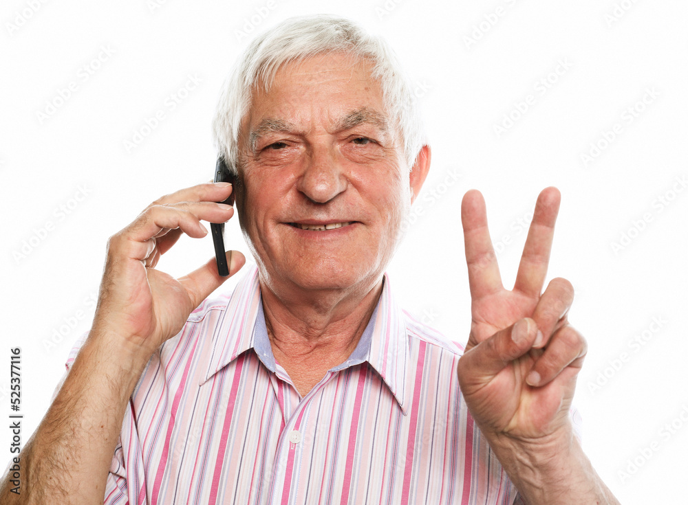 Portrait of positive old man hold new cellphone show v-sign sign recommend choose good modern technology Portrait of positive old man hold new cellphone show v-sign sign recommend choose good modern technology