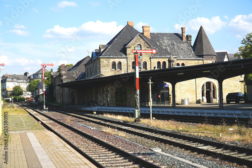 Historic train station in Goslar with railroad tracks, signals and the old station building made of natural stones, Harz Mountains, Germany, Europe