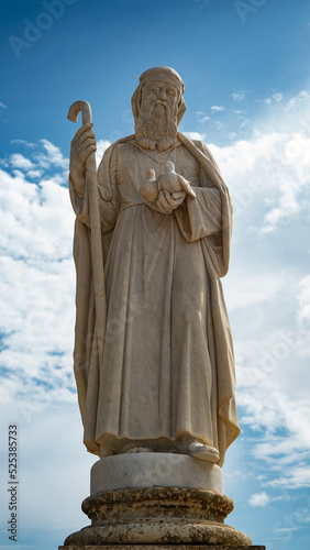 Marble statue of male figure with staff and two doves at the National Shrine of the Blessed Virgin of Ta' Pinu, Gozo, Malta. 