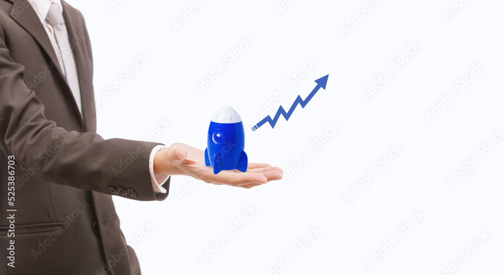 Business man holding and launching blue rocket with graphic arrow on white background, start up with new idea is the winner way in fast business world concept Business man holding and launching blue rocket with graphic arrow on white background, start up with new idea is the winner way in fast business world concept