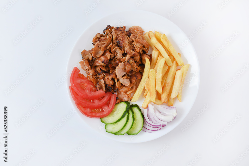 Doner salad plate, kebab chicken meat on white plate. Turkish food. Isolated on white background. Flat lay Doner salad plate, kebab chicken meat on white plate. Turkish food. Isolated on white background. Flat lay