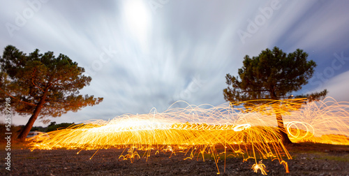 Steel wool and astrophotography, photographed at night with the long exposure technique. photo