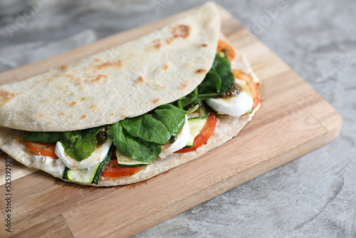 Italian cuisine , Piadina with tomatoes and cheese photo