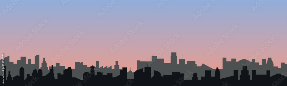 Vector drawing of a fictional city skyline and in the background a blue and pink sky of a late afternoon.