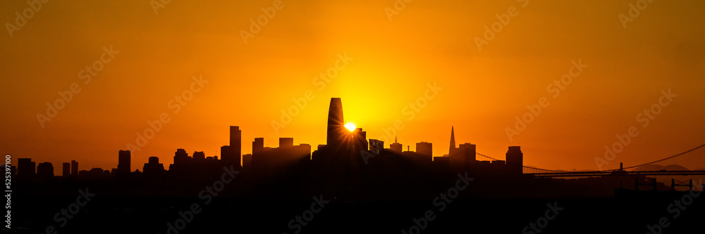Golden hour silhouette of the cityline of the San Francisco Bay area in California, USA