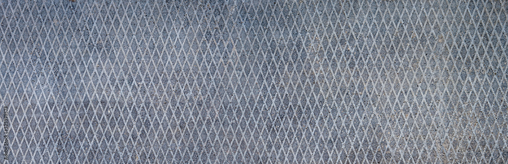Panorama of the surface of a concrete slab with a pattern of rhombuses. Panorama of the surface of a concrete slab with a pattern of rhombuses.