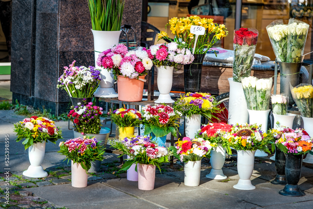 street sale of flowers. bouquets of various beautiful flowers on the street.