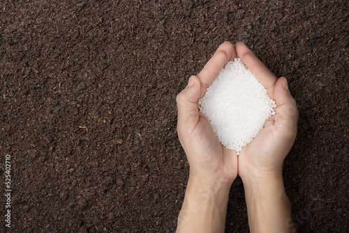 Chemical fertilizers in hand. nitrogen photo