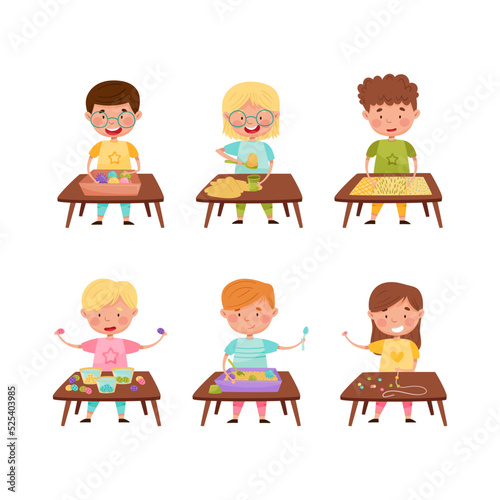 Cute kids standing at table and playing with sand, beads and buttons set. Preschool activities and early childhood education cartoon vector illustration
