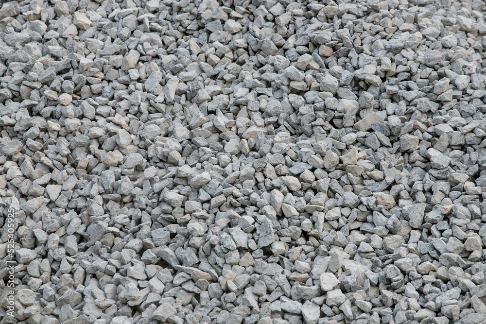 Road construction gravel texture , close up on pile of gravel for construction of a road at a construction site. Road construction background Road construction gravel texture , close up on pile of gravel for construction of a road at a construction site. Road construction background