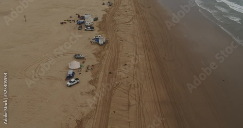 Aerial of sand dunes and beach with RVs at Oceano Dunes SVRA at Pismo Beach, California photo