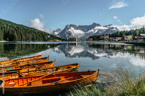 Lake Misurina,Lago di Misurina is pearl of the Dolomites.Mountain lake in Italy with wooden boats,Veneto region,Sorapis mountain group.Perfect destination for hiking.Touristic resort for holiday © Eva