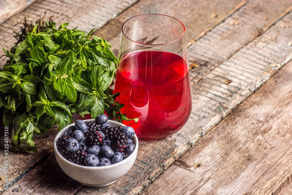 Berry lemonade, mint and blueberries. Bowl of blueberries and blackberries