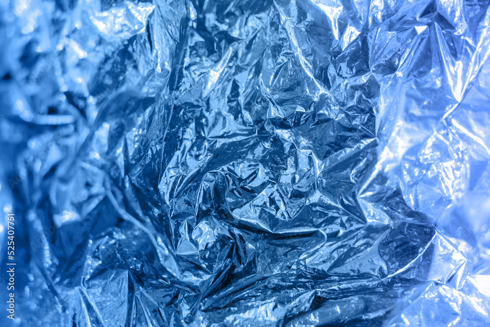 Iridescent foil texture background. Holographic wrinkled surface. Vibrant blue gradient template for design. Banner with copy space Iridescent foil texture background. Holographic wrinkled surface. Vibrant blue gradient template for design. Banner with copy space