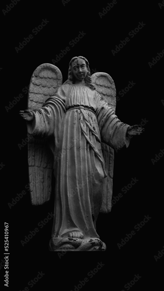 Ancient statue of angel. Black and white vertical image.