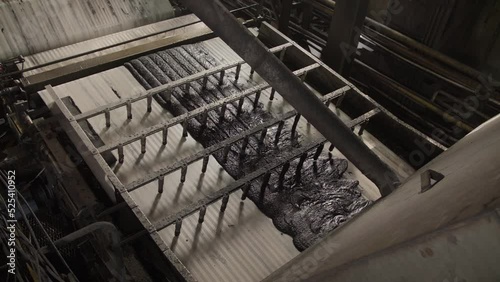 Sludge moves along the conveyor belt. Wastes from process of cleaning coal from garbage rock. Sludge thickening and dewatering