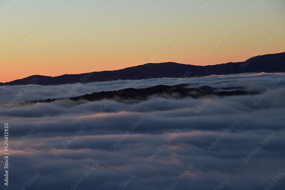 peaks above the clouds