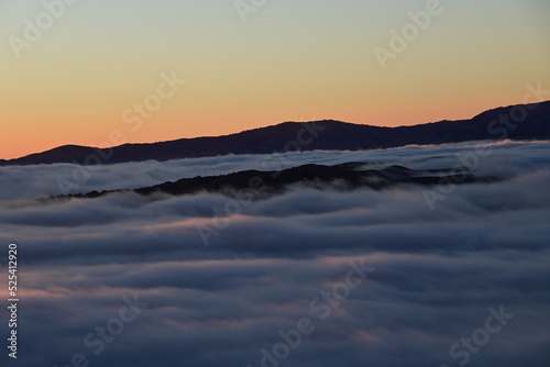peaks above the clouds