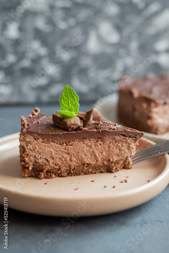 delicious sweet chocolate cake cheesecake in a restaurant mint leaf on a plate