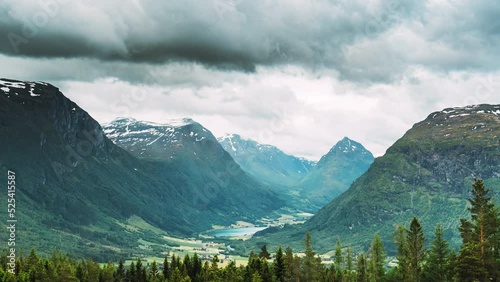 Byrkjelo Village, Sogn Og Fjordane County, Norway. Beautiful Sky Above Norwegian Rural Landscape. Bergheimsvatnet Lake In Summer Day. Agricultural And Weather Forecast Concept. Time-lapse 4k. photo