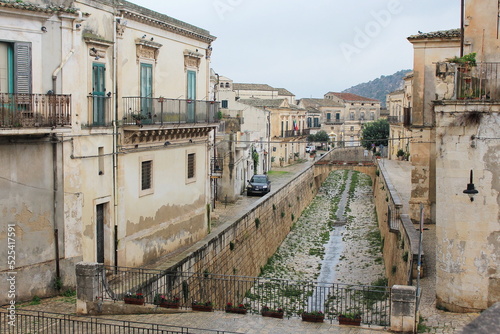 Old historic bridge in a beautiful sicilian city, panorama of the center of Scicli / Sicily, Italy.
