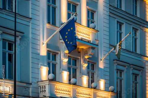 EU flag on government building, illuminated EC flag photo