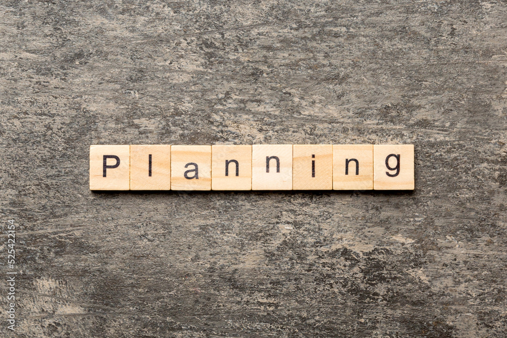 Fototapeta premium planning word written on wood block. planning text on table, concept