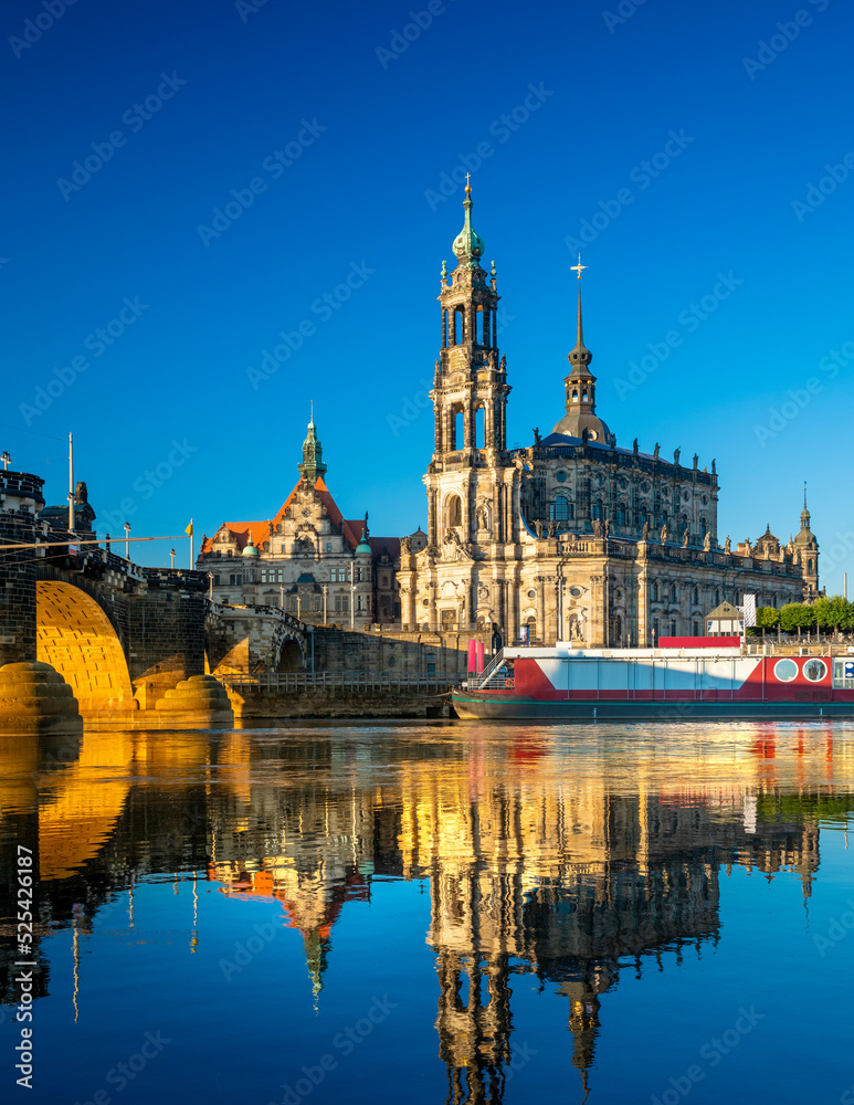 Augustus Bridge and Cathedral of the Holy Trinity with reflections in the river Elbe. Dresden, Saxony, Germany