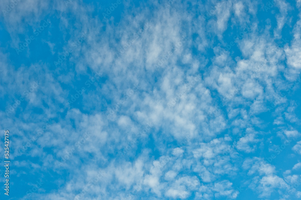 blue background, the photo shows a blue sky and clouds, bottom view blue background, the photo shows a blue sky and clouds, bottom view