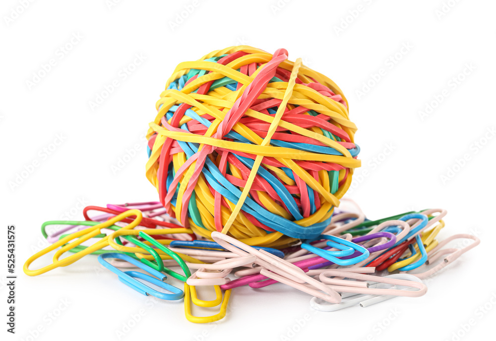 Colorful rubber band ball and paper clips on white background