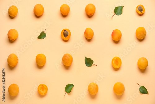 Many ripe apricots on color background