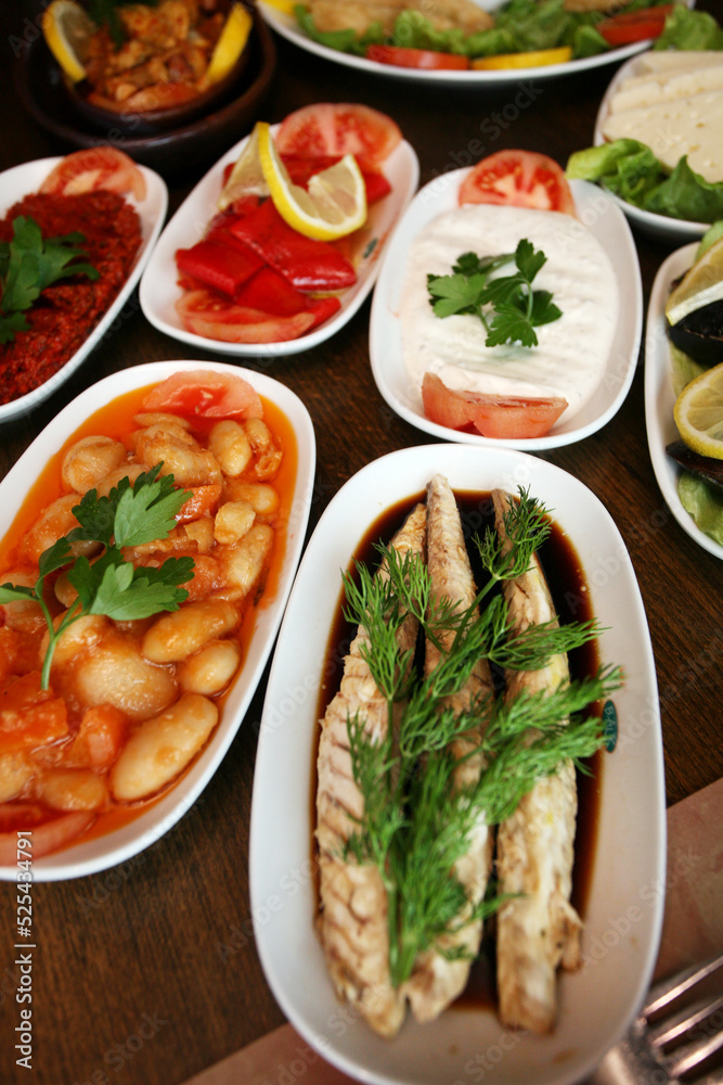 Traditional Turkish appetizer foods (Turkish meze) on the restaurant table. Traditional Turkish appetizer foods (Turkish meze) on the restaurant table.