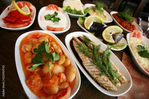 Traditional Turkish appetizer foods (Turkish meze) on the restaurant table.